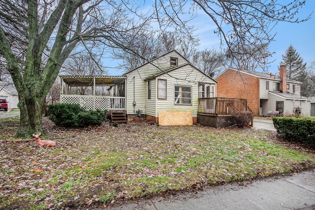 view of front of property featuring a wooden deck