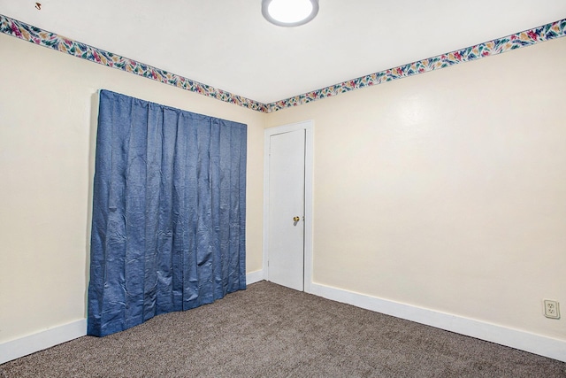 spare room with carpet floors