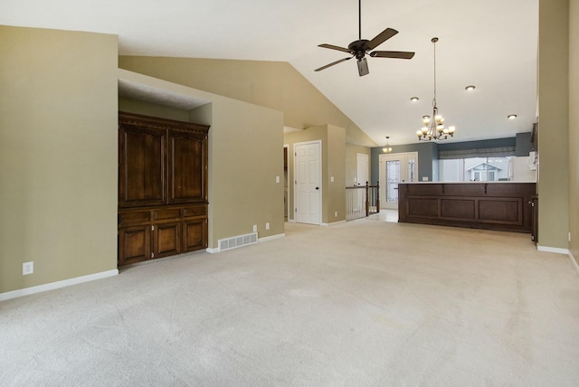 unfurnished living room with high vaulted ceiling, light colored carpet, and ceiling fan with notable chandelier