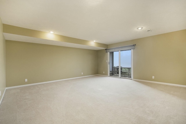 empty room featuring light colored carpet