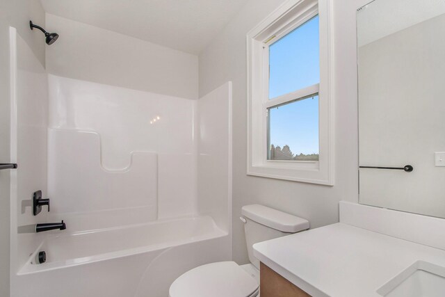 full bathroom featuring vanity, shower / bath combination, and toilet