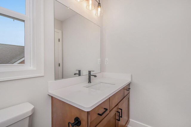 bathroom with vanity and toilet