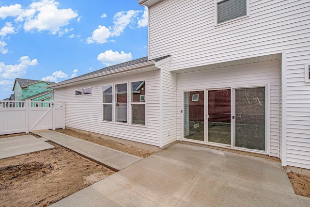 back of house with a patio