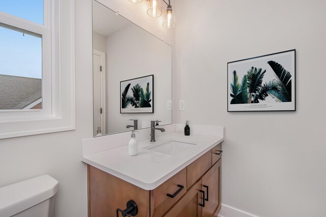 bathroom with vanity and toilet