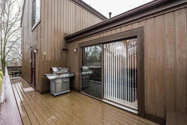 wooden terrace featuring area for grilling