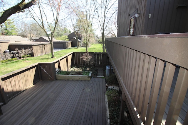 wooden terrace with a lawn