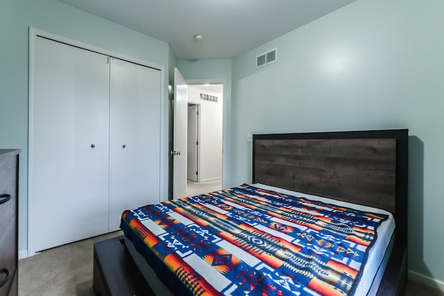 carpeted bedroom with a closet