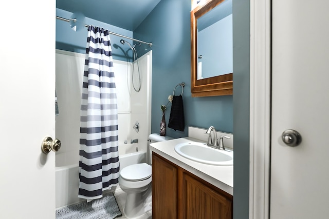 full bathroom with tile patterned flooring, shower / bath combination with curtain, vanity, and toilet