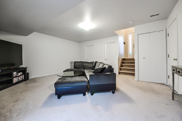 living room featuring light colored carpet