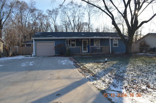 single story home featuring a garage and covered porch