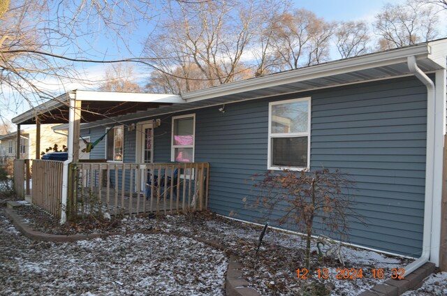 view of side of home featuring a porch