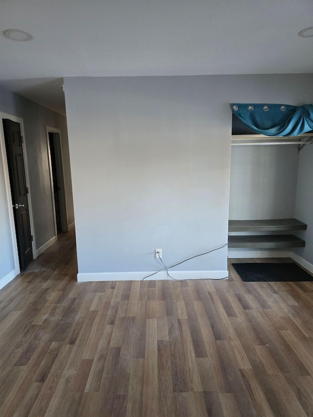 empty room featuring hardwood / wood-style flooring