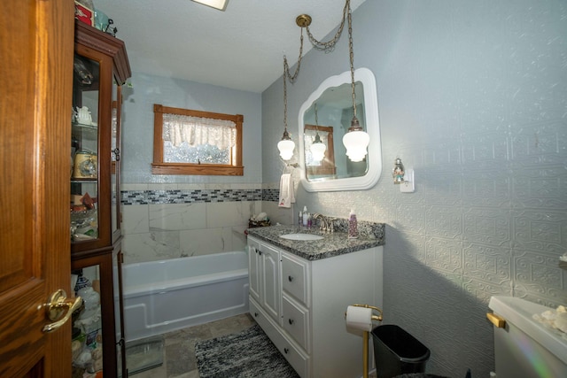 bathroom featuring vanity and a tub