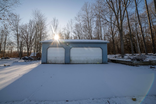 view of snow covered garage