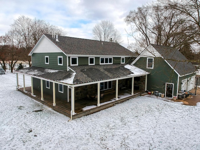 view of snow covered house