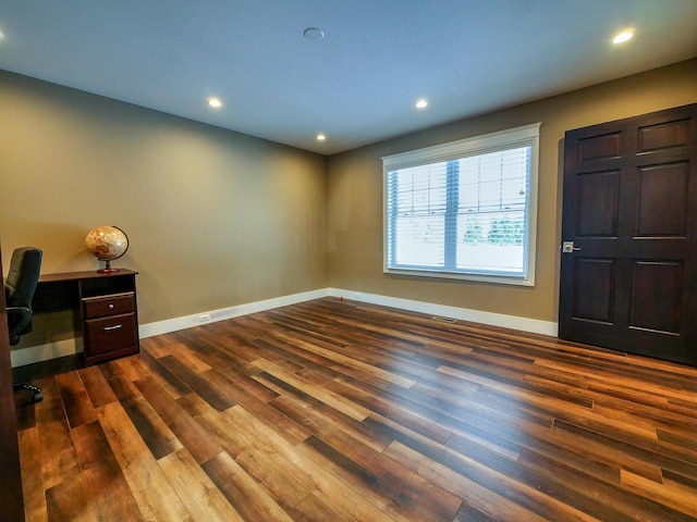 foyer entrance with dark wood-type flooring