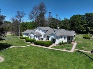 rear view of property with a lawn