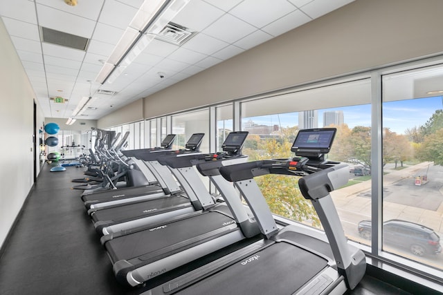 gym featuring a drop ceiling