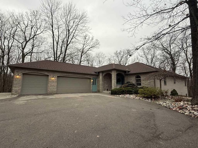 single story home with a garage