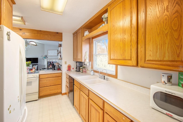 kitchen featuring white appliances and sink