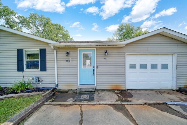 single story home featuring a garage