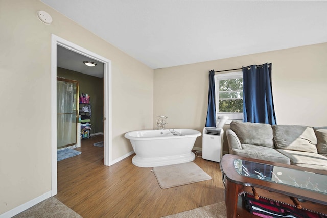 bathroom featuring a bathing tub and hardwood / wood-style floors