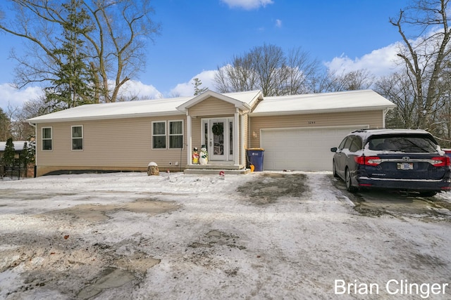 ranch-style home with a garage