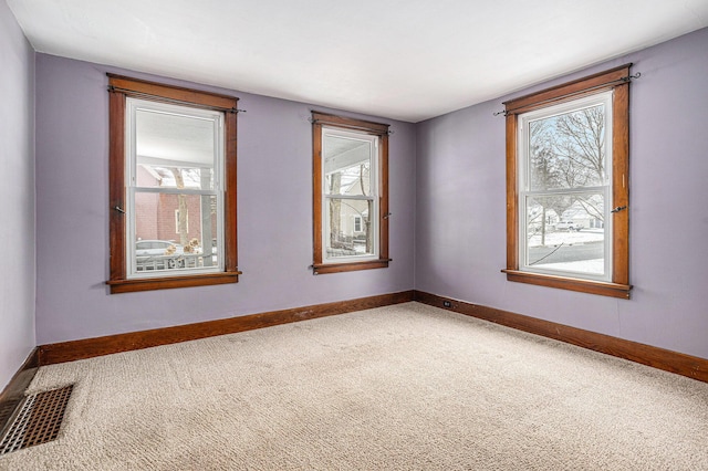 empty room featuring carpet floors