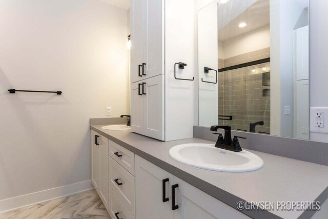 bathroom featuring vanity and a shower with shower door