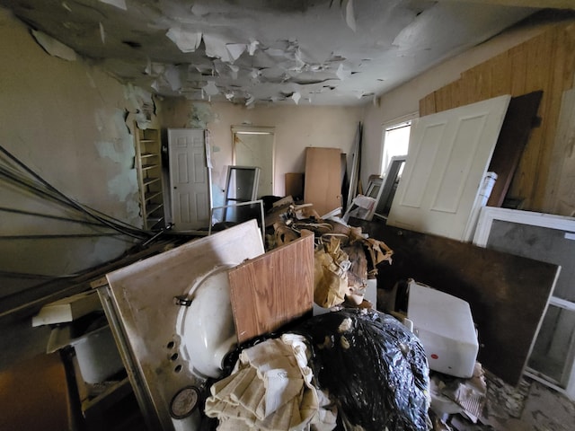 miscellaneous room featuring wooden walls