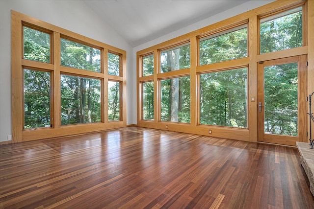 unfurnished sunroom with vaulted ceiling and a healthy amount of sunlight