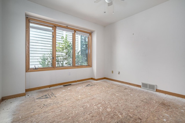 unfurnished room with ceiling fan