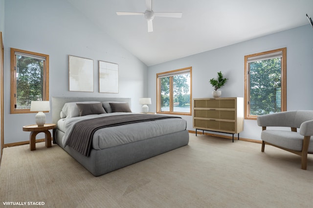 bedroom featuring ceiling fan, light carpet, and high vaulted ceiling