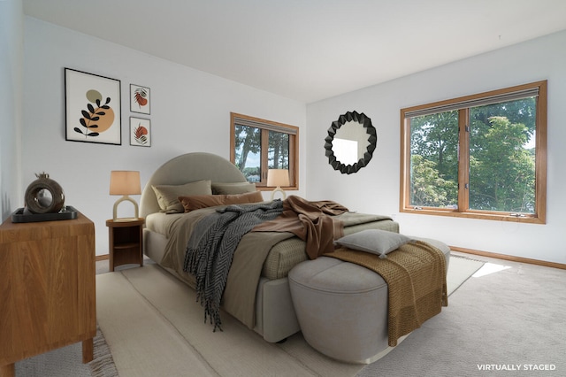 carpeted bedroom with multiple windows