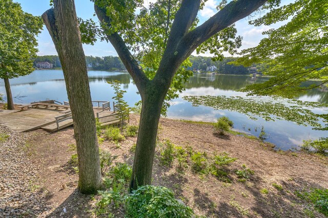 property view of water featuring a boat dock