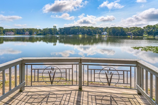 wooden deck featuring a water view