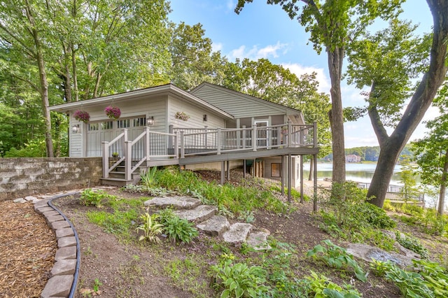 view of front facade featuring a deck with water view