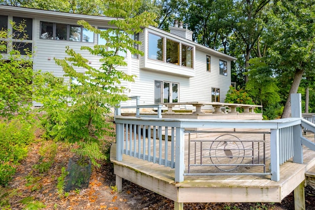 back of house featuring a wooden deck