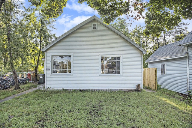 view of side of property with a yard