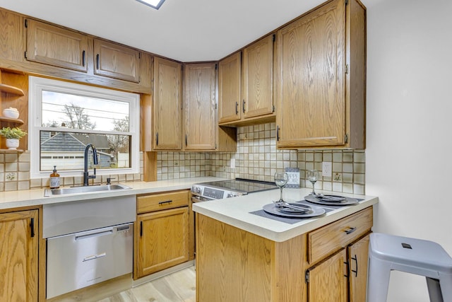 kitchen with light wood-type flooring, sink, and tasteful backsplash