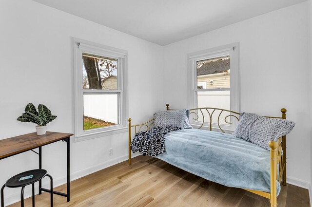 bedroom with light wood-type flooring