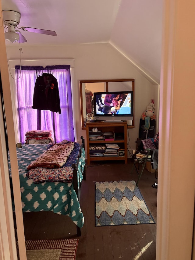 bedroom with hardwood / wood-style floors, vaulted ceiling, and ceiling fan