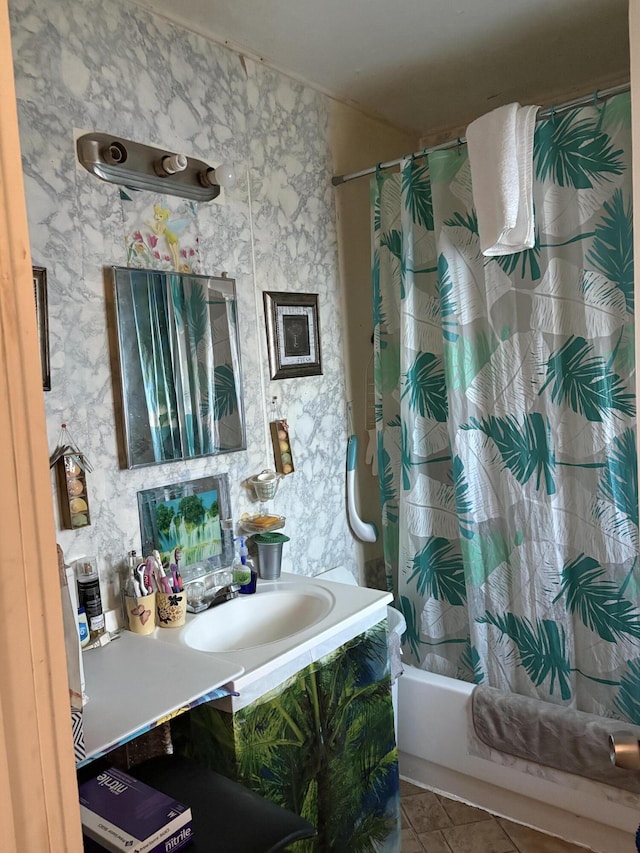 bathroom with shower / tub combo, tile patterned floors, and sink