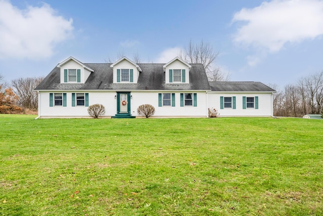 cape cod house featuring a front lawn