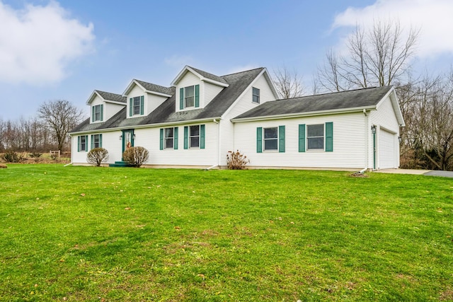 cape cod-style house featuring a garage and a front lawn