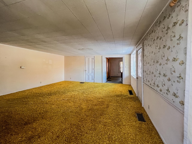 unfurnished room with carpet floors