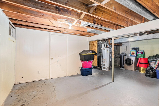 basement with separate washer and dryer and water heater