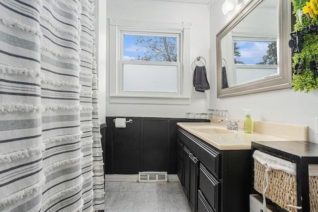 bathroom with a wealth of natural light and vanity