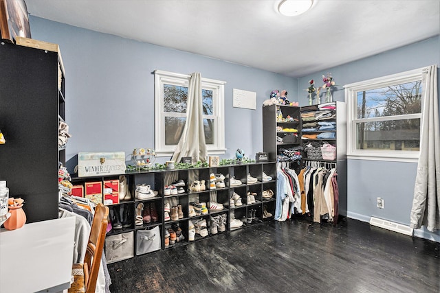 walk in closet featuring dark hardwood / wood-style floors