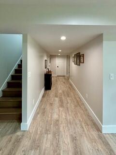 hallway featuring light wood-type flooring